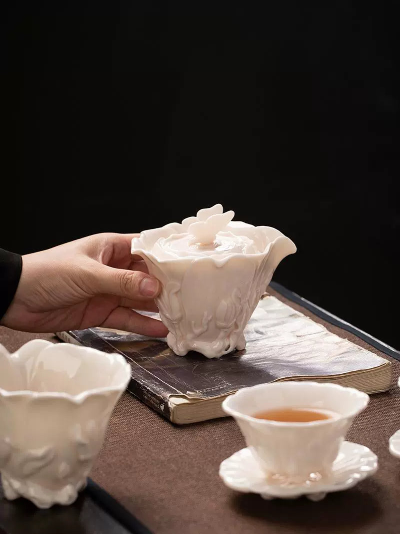 Dehua mutton fat jade white porcelain handmade children's red set of a pot of two cups of magnolia