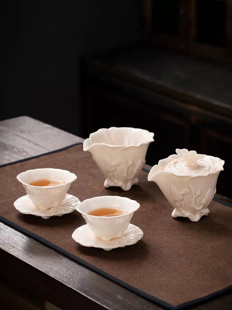 Dehua mutton fat jade white porcelain handmade children's red set of a pot of two cups of magnolia